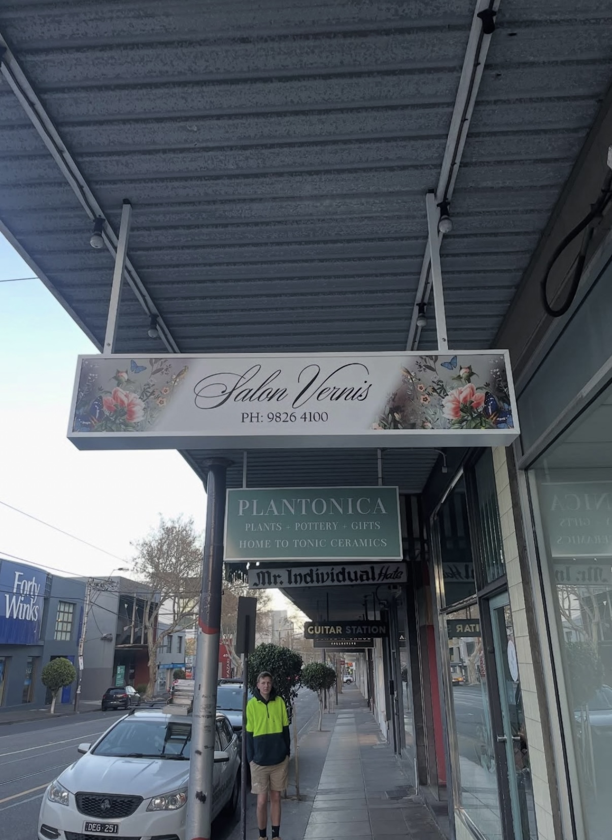 Salon Vernis — hanging shopfront signage