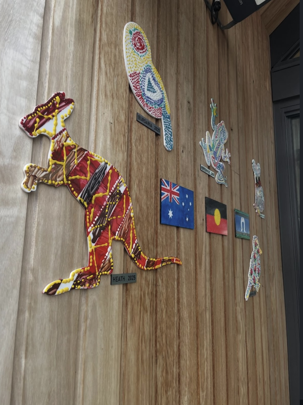 Custom cut-out signage — indigenous artwork display